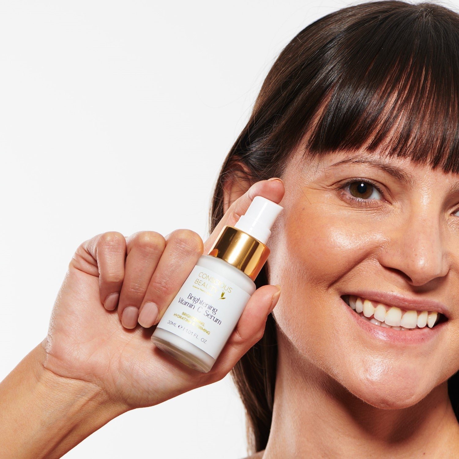 Model applying Conscious Beauty Australia - Flawless Collagen Face Serum