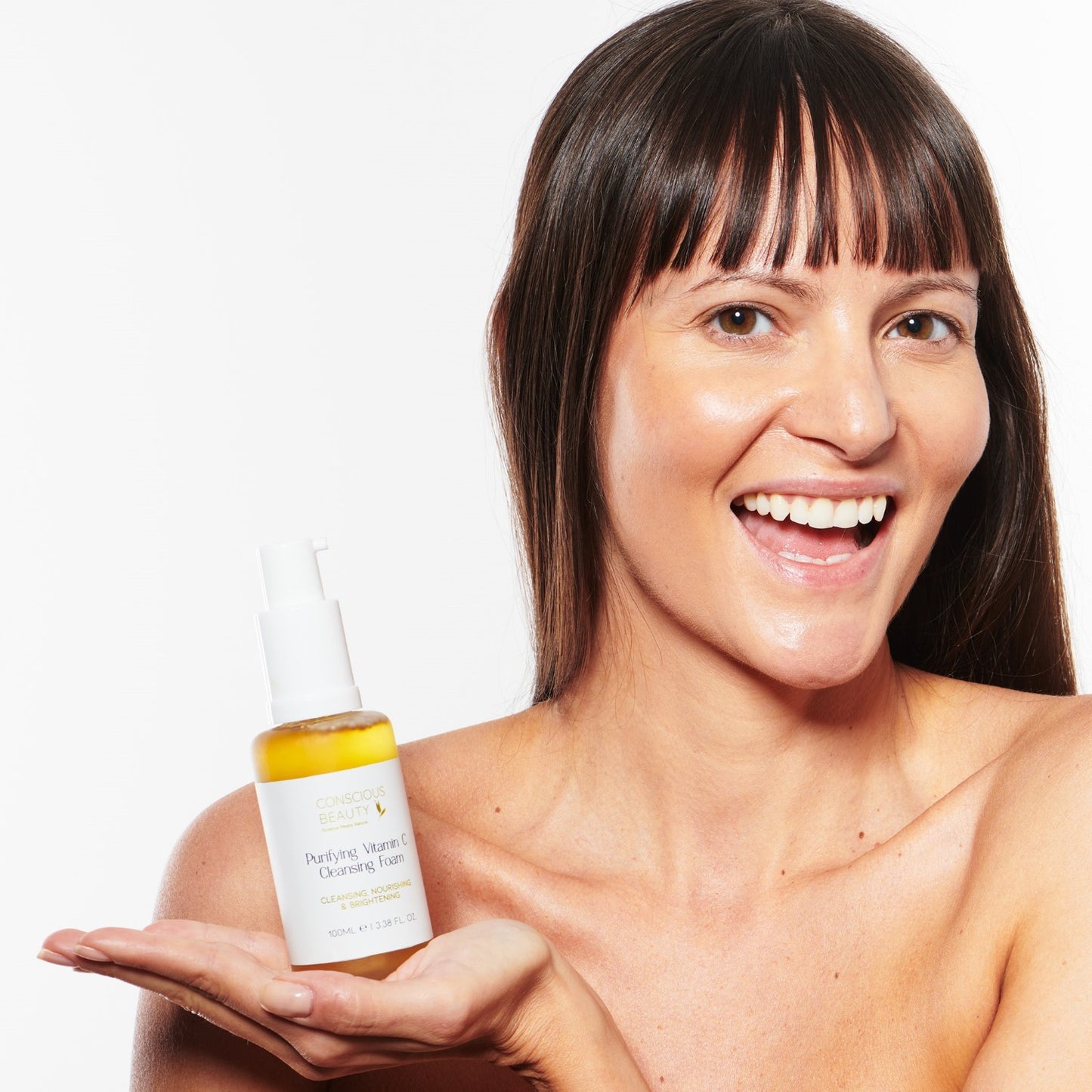 Female model holding Conscious Beauty Australia - Purifying Vitamin C Cleansing Foam