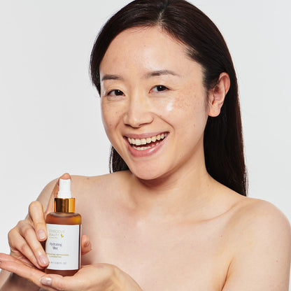 Female model holding Conscious Beauty Australia - Hydrating Mist